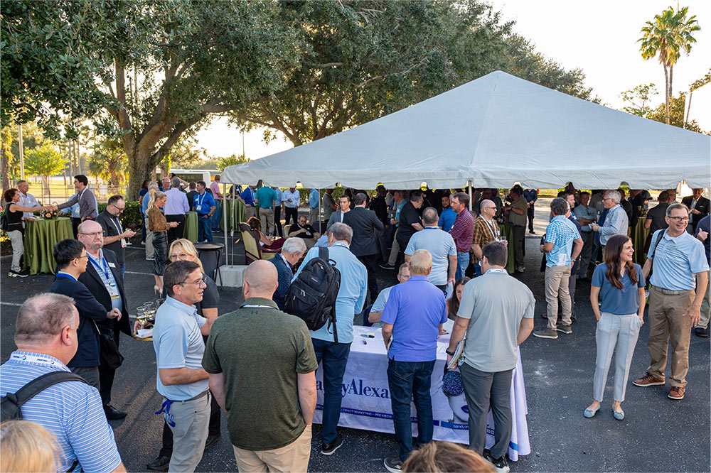 Conversations spark and curiosity builds as attendees get ready for the Truepress JET 560HDX experience.
